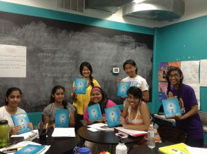 SYWC participants with their summer reading book, Tina's Mouth. 