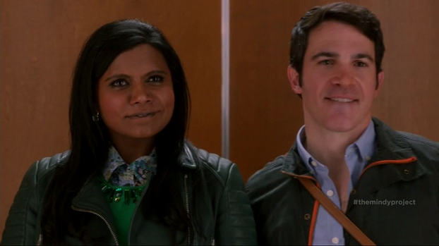 Yes, Danny is grabbing Mindy's butt in the elevator. 