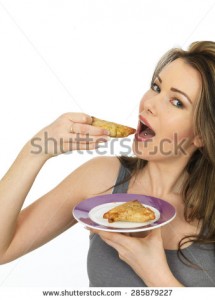 stock-photo-attractive-young-happy-woman-eating-an-indian-style-spicy-samosa-savory-snack-285879227