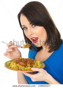 stock-photo-attractive-young-woman-eating-lamb-rogan-josh-indian-curry-239022277