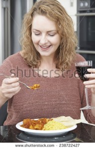 stock-photo-woman-eating-takeaway-curry-and-drinking-wine-238722427